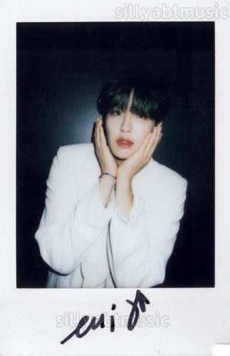Signed polaroid of Louis cupping his face