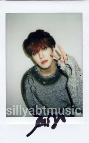 Polaroid of Louis making a peace sign