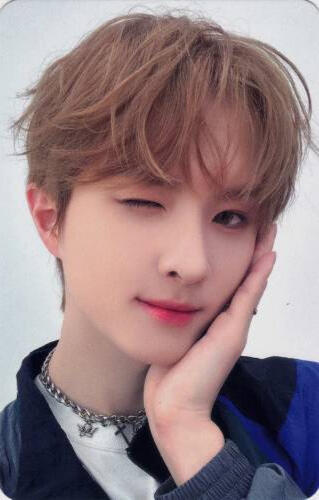 Photocard of Ivan cupping his face and winking