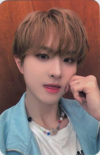Photocard of Ivan pinching his cheek and sticking his tongue out