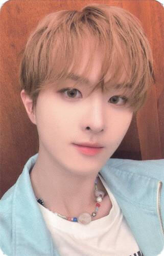 Photocard of Ivan wearing a blue denim jacket and white shirt, smiling at the camera