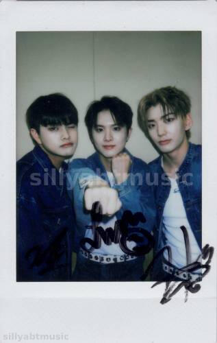 A signed polaroid of Hwon, Ivan, and Jahan