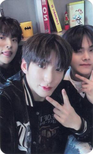 Photocard of Mujin, Hwon, and Jahan looking at the camera and posing