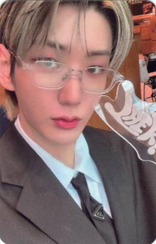 Photocard of Hwon wearing a grey suit and clear-frame glasses while holding the Realize lightstick