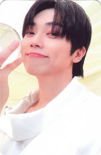 Photocard of Minkyun from ONF smiling with a glass orb