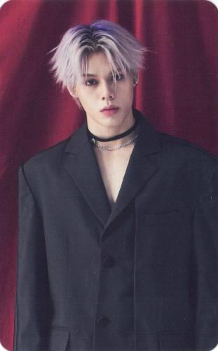 Photocard of Prince from Ghost9 wearing a black suit jacket and choker, posed in front of a red curtain
