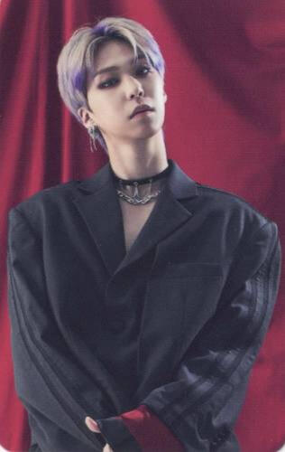 Photocard of Shin from Ghost9 wearing a black suit jacket and choker, loosely crossing his arms in front of a red curtain
