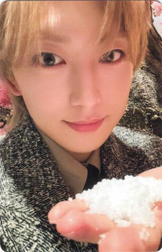 Photocard of Fuma offering a small handful of snow forward