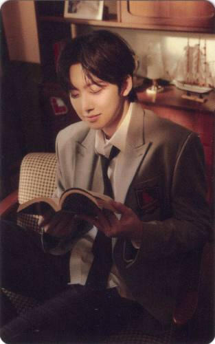 Photocard of Fuma fondly reading a book