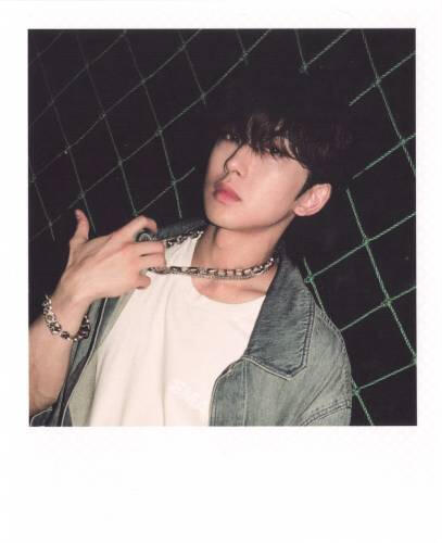 Fake polaroid of Fuma pulling his chain necklace