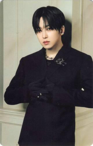 Photocard of Fuma dressed in all black, leaning against a pillar and interlocking his fingers