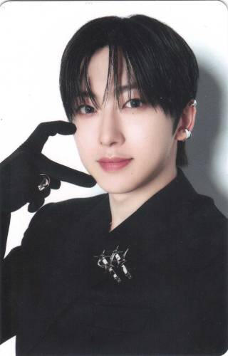 Photocard of Fuma dressed in all black making a hand heart against his cheek