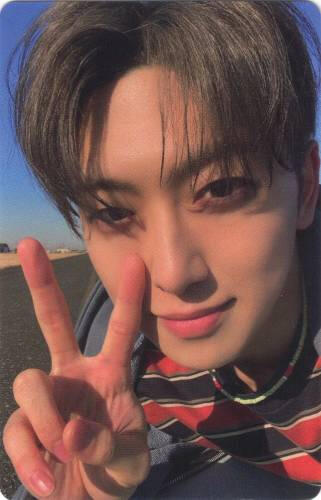 Photocard of Fuma outside on a sunny day making a peace sign