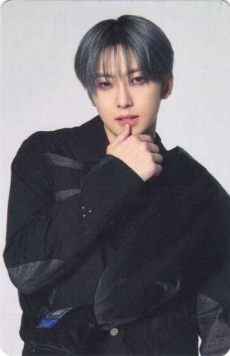 Photocard of Fuma in black techwear swiping a thumb on his lip