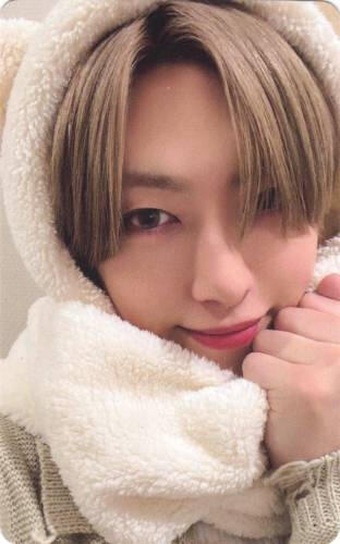 Photocard of Fuma wearing a fluffy hood he holds close to his face