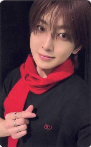 Photocard of Fuma wearing a red scarf and making a finger heart