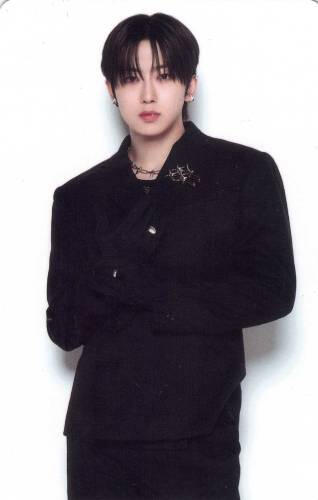 Photocard of Fuma dressed in all black and holding his wrist