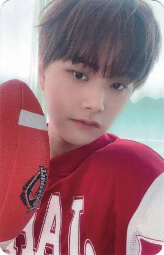 Photocard of Jahan in football gear holding a football by his face