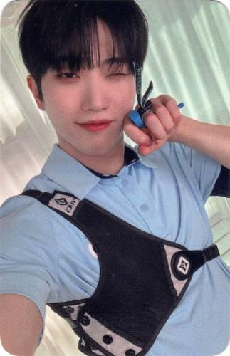 Photocard of Dann in archery gear winking