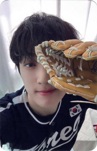 Photocard of Arthur in baseball gear, holding the gloved hand in front of his face