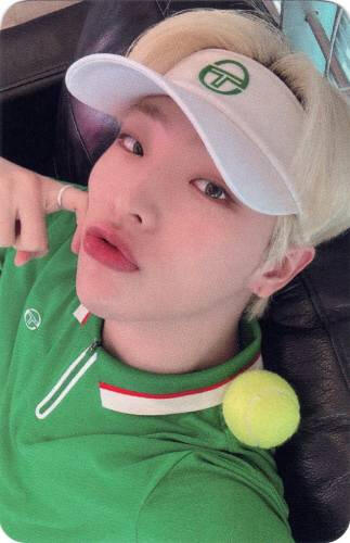 Photocard of Mujin in tennis gear, poking his cheek
