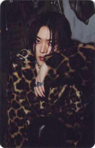 Photocard of Yuta wearing a leopard print jacket and staring coldly at the camera