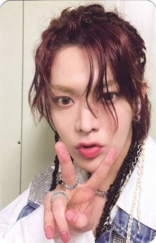 Photocard of Yuta making a peace sign and kissy face