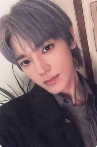 Photocard of Taeyong from NCT wearing a black jacket and grey shirt, looking into the camera