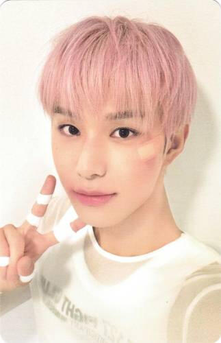 Photocard of Jungwoo with bandaids on his hands and fingers making a peace sign