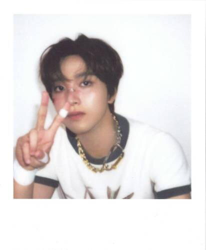 Fake polaroid of Haechan with bandaids on his face making a peace sign