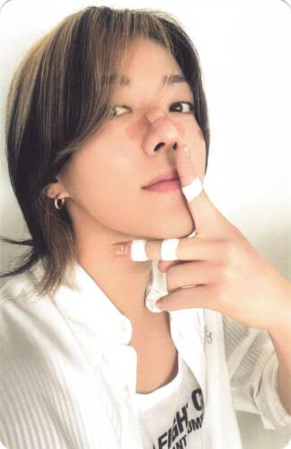 Photocards of Yuta making a peace sign with bandaids on his face and fingers