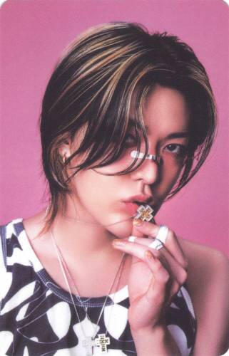 Photocard of Yuta with bandaids on his face kissing his necklace