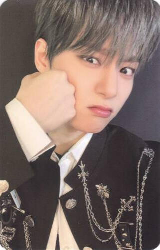 Photocard of Hwanwoong holding a fist to his cheek