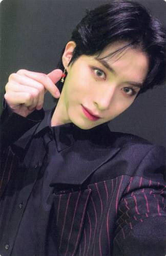 Photocard of Xion wearing a dark purple suit and holding up a finger heart