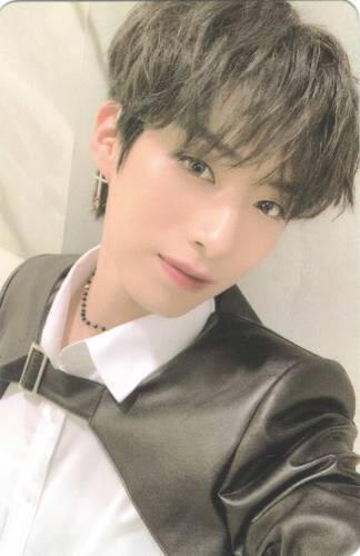 Photocard of Xion smiling gently at the camera