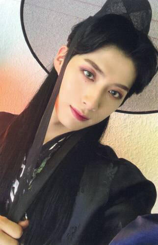 Photocard of Xion wearing Hanbok and looking into the camera