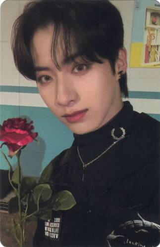Photocard of Xion holding a rose