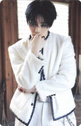 Photocard of I.N posed with one arm crossed and the other hand in front of his mouth