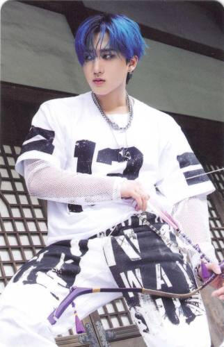 Photocard of Changbin posing with a bow and arrow