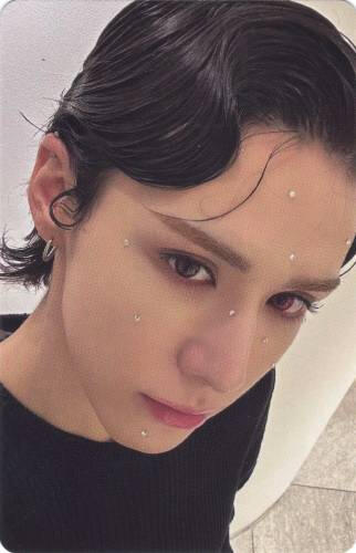Photocard of Wumuti of Xlov with gems on his face