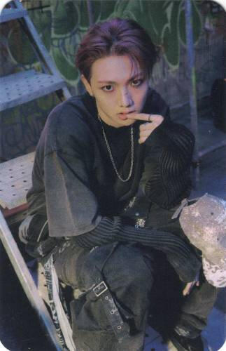 A photocard of Hyunbin from Allhours looking up at the camera