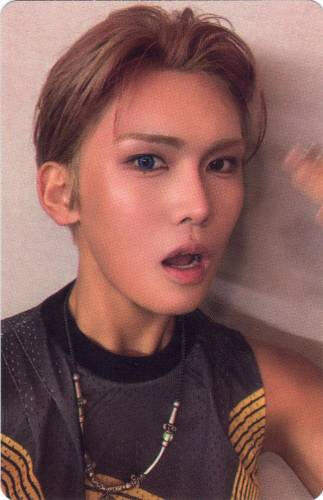 Photocard of Hyun making a surprised face