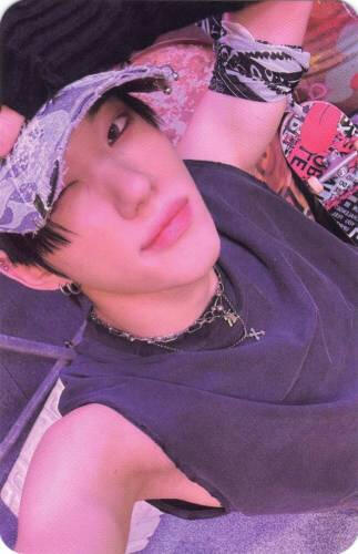 A Photocard of Xayden of Allhours with a hand on his hat