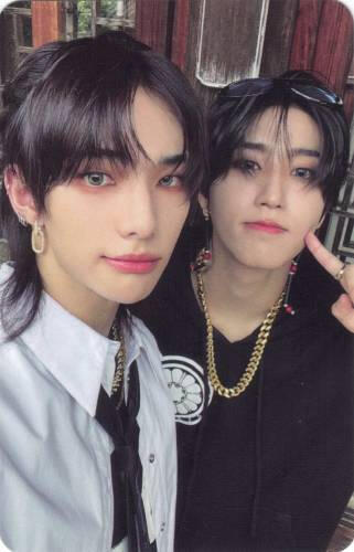 Photocard of Han and Hyunjin looking casually at the camera