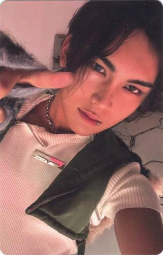 Photocard of Hyun of Xlov pointing a finger gun at the camera