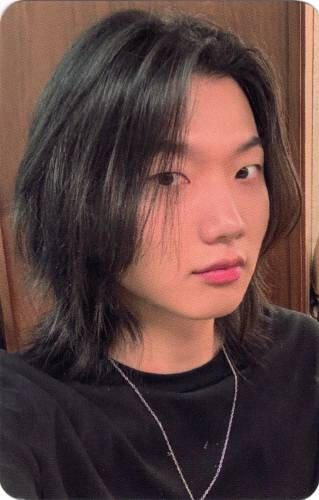 A photocard of Ganghun of Dragon Pony looking at the camera