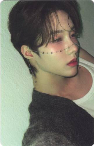Photocard of Rui of Xlov looking to the side with a bejeweled chain across his nose