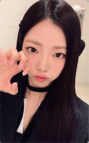 Photocard of Goeun making a clawed hand towards the camera