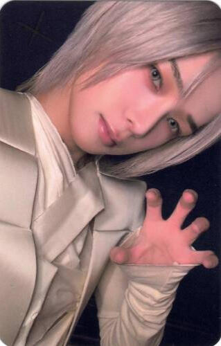 Photocard of Yudai with silver hair making a clawed hand