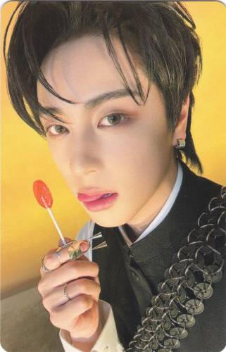 Photocard of Taki holding a lollipop and sticking his tongue out
